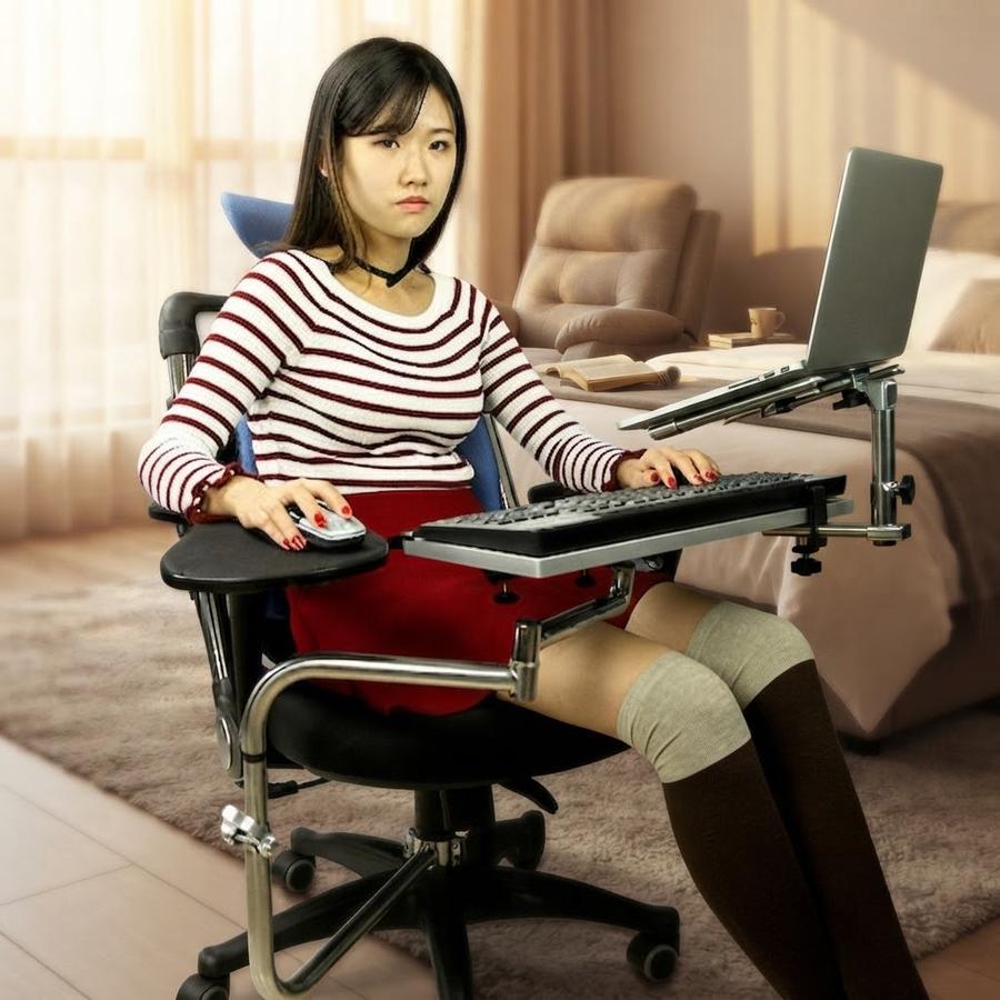 MagicHold Chair-Mounted Keyboard and Mouse Stand in use